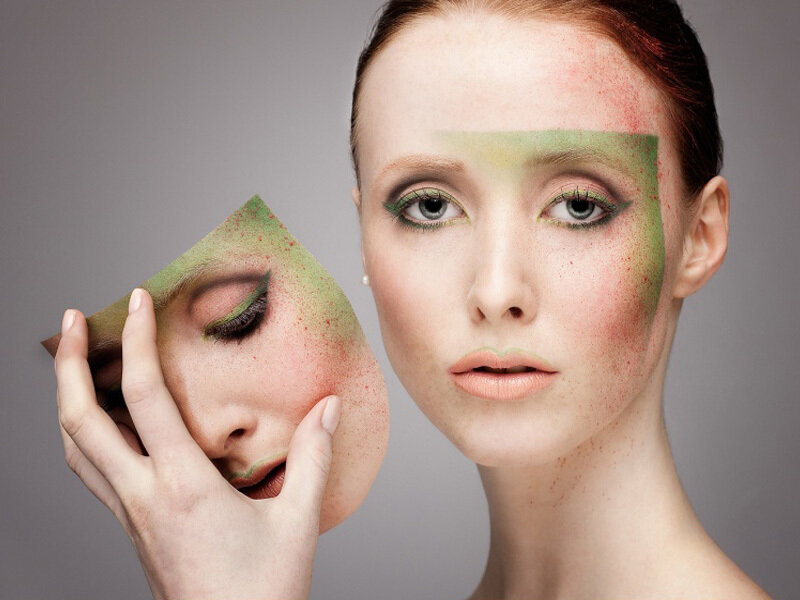 Woman Holding Face Mask