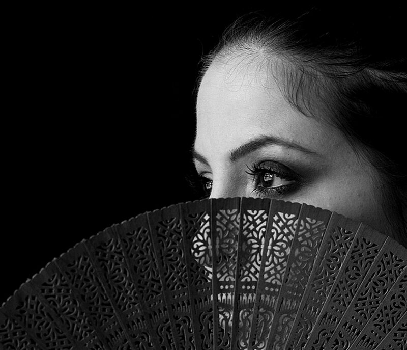 Woman Holding Fan — Black, Dramatic, Photograph, Eye