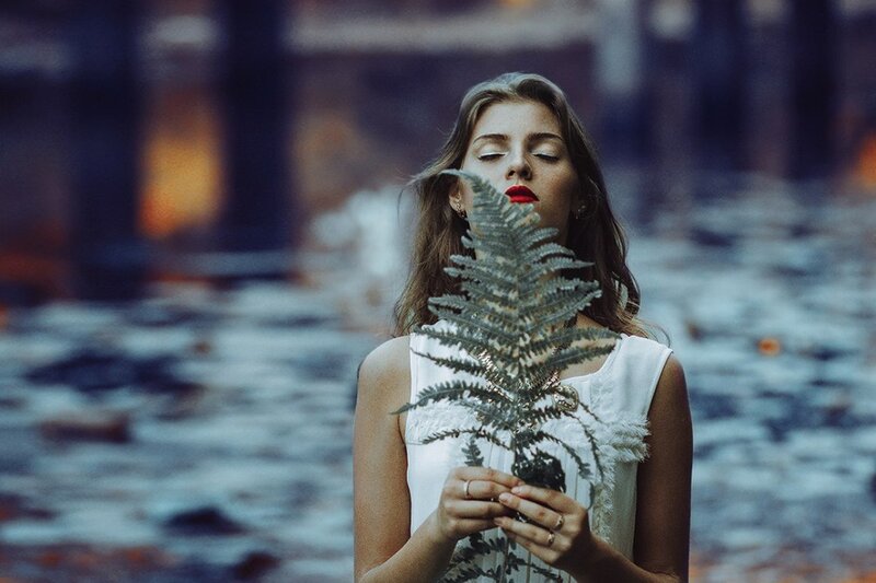 Woman Holding Fern