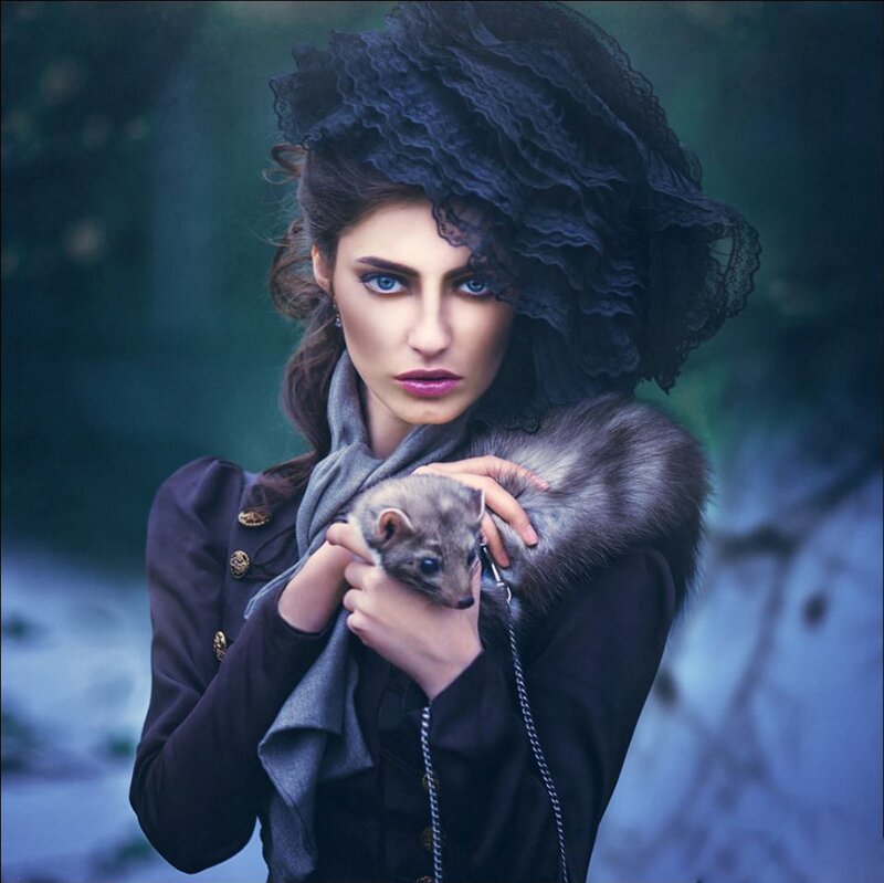 Woman Holding Ferret