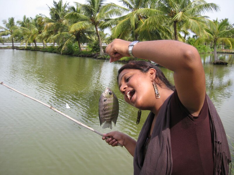 Woman Holding Fish — Green