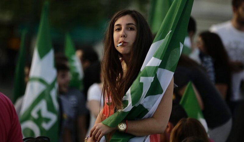 Woman holding flag at protest