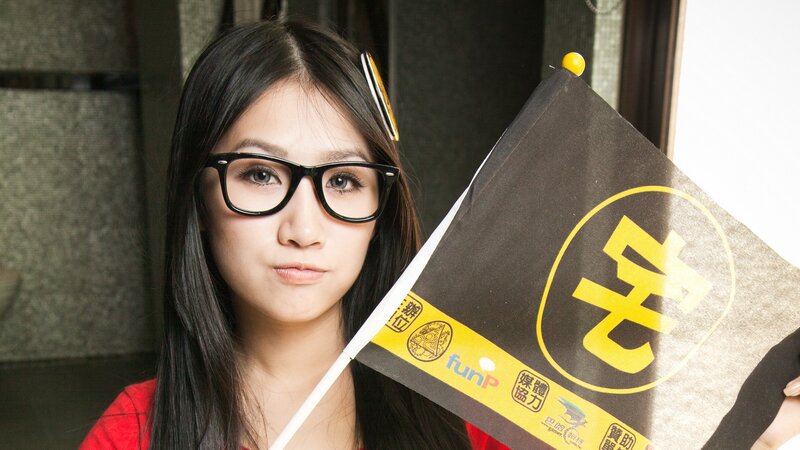 woman holding flag with logo