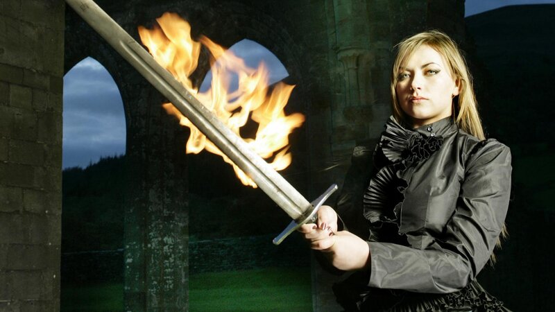 woman holding flaming sword