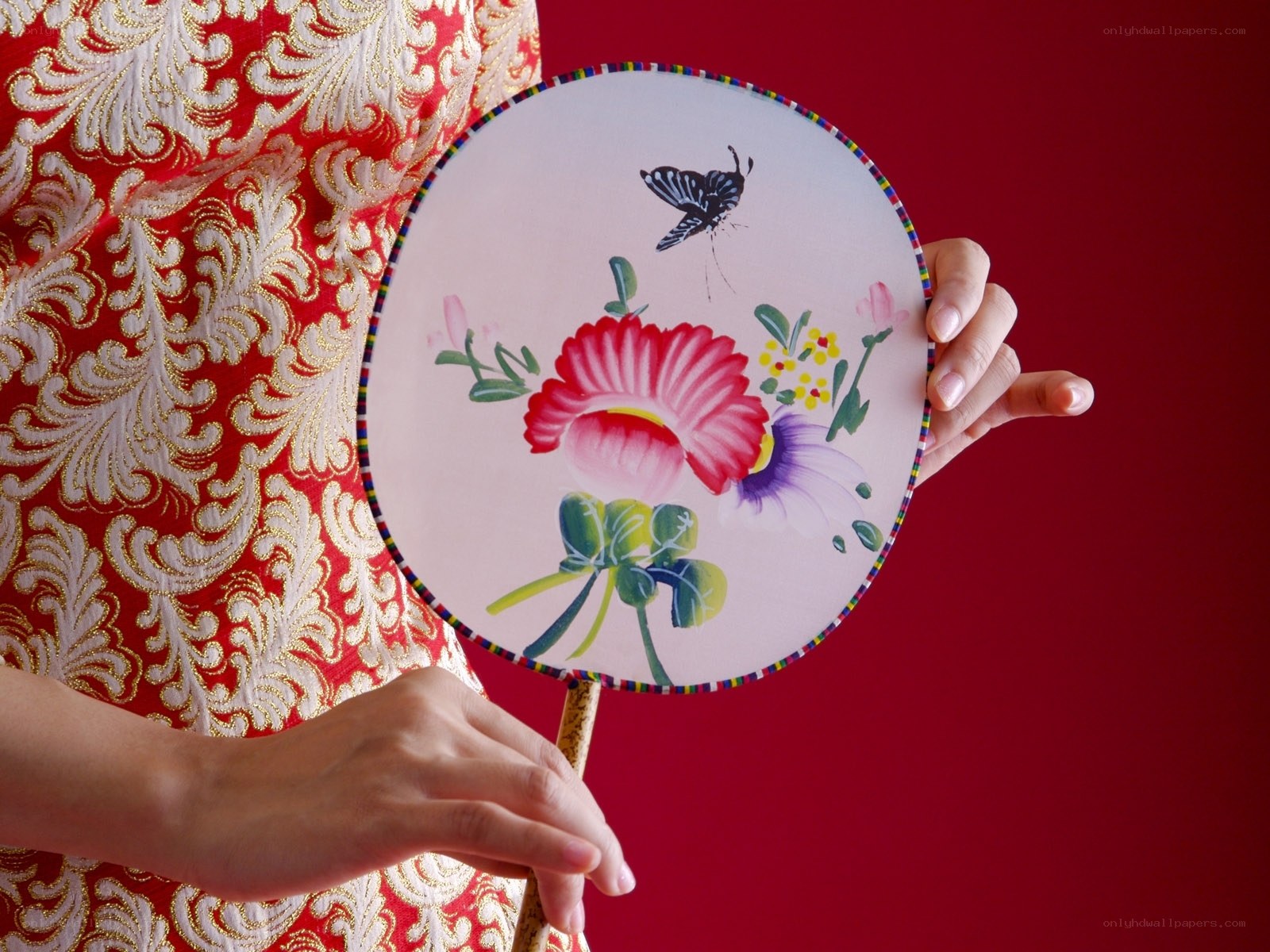 Woman holding floral fan