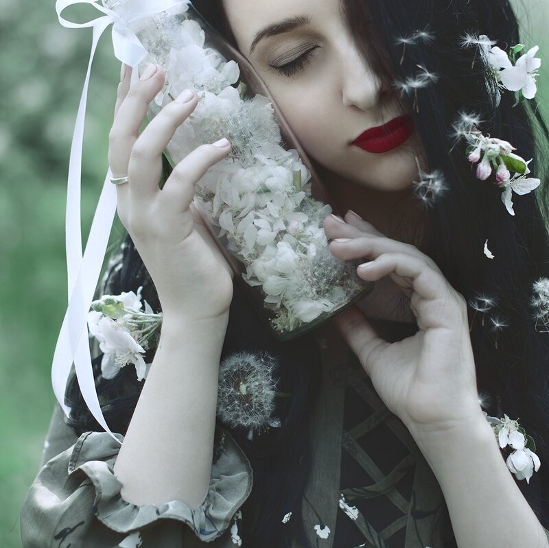 Woman Holding Flower Bottle