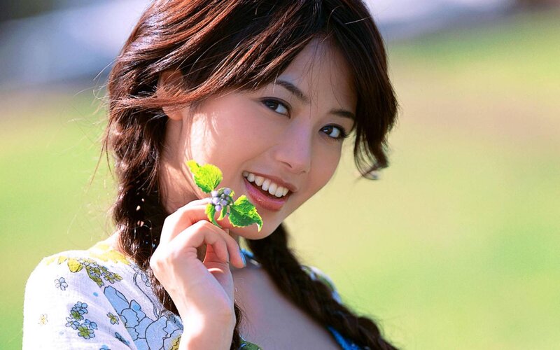 Woman Holding Flower — Green, Serene, Afternoon, Photograph, Braided Hair