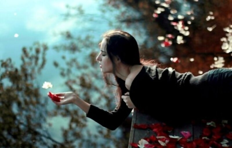 Woman Holding Flower Petal