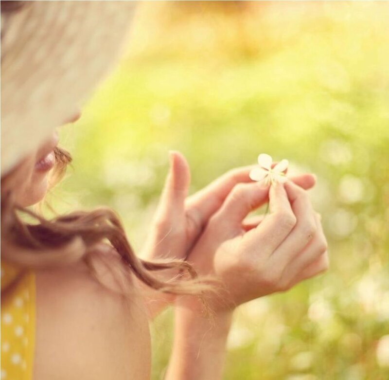 Woman Holding Flower — Yellow, Serene