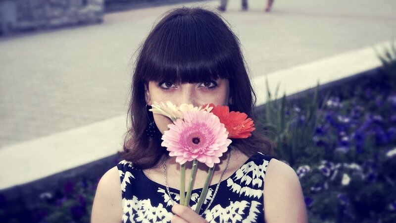 woman holding flowers
