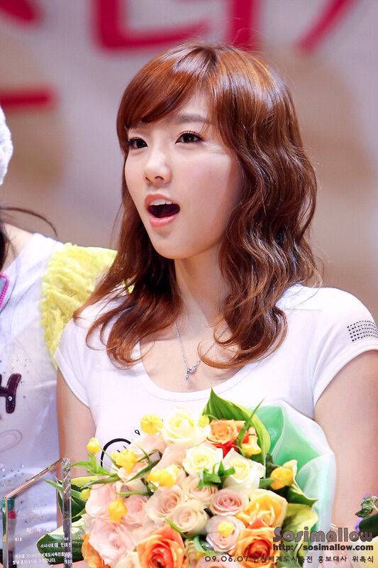 woman holding flowers at event