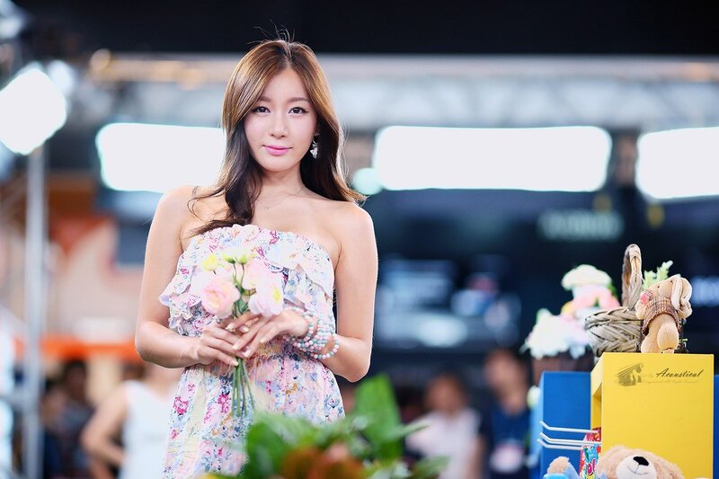 Woman holding flowers at event