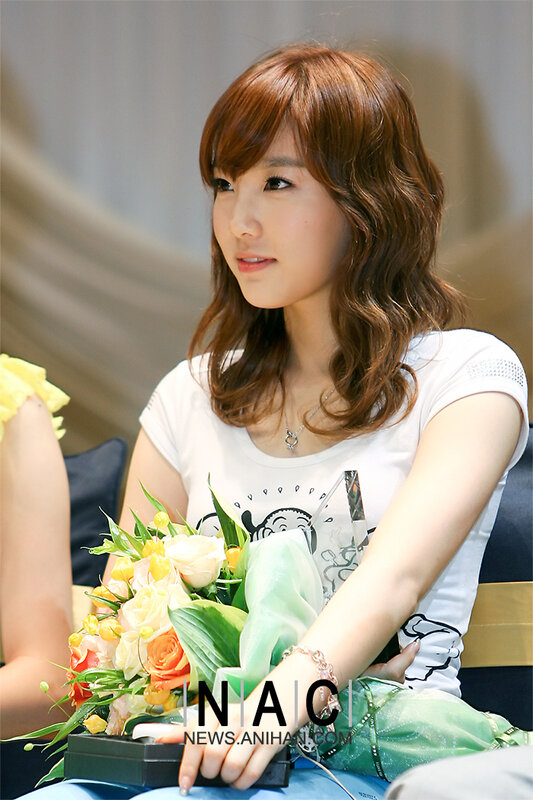 woman holding flowers at event