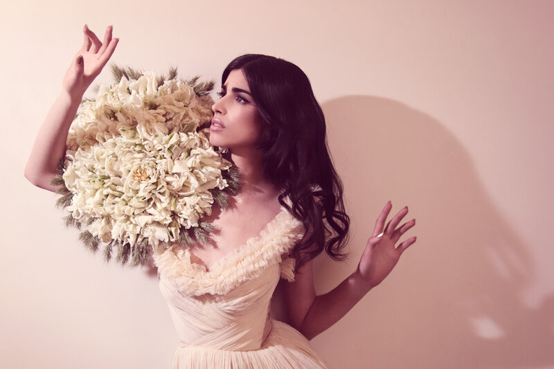 Woman Holding Flowers — Beige