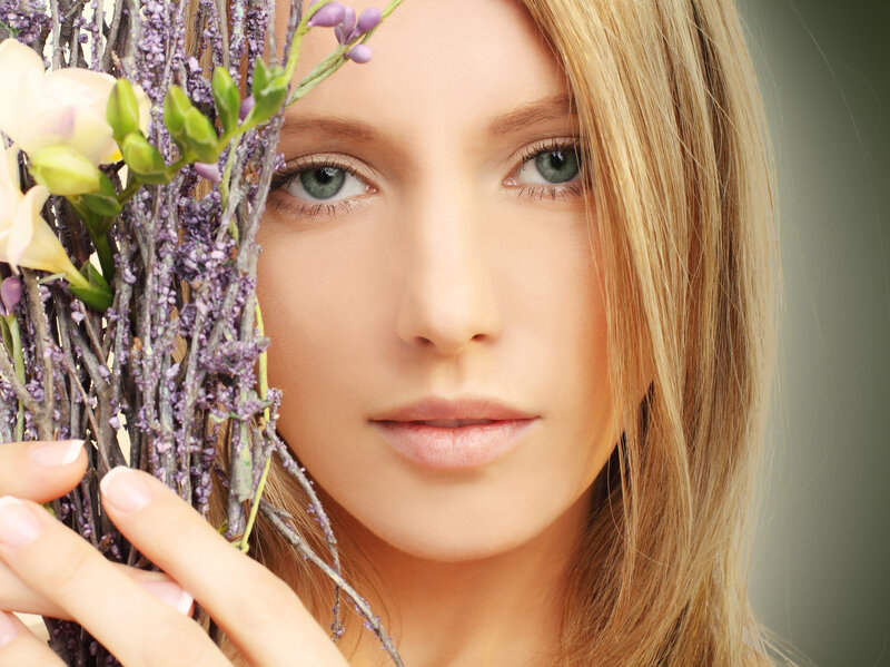 Woman Holding Flowers — Blonde
