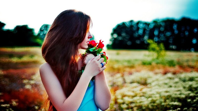 Woman Holding Flowers — Blue, Serene, Sunset