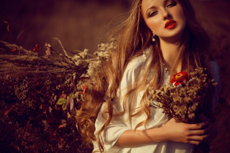 Woman Holding Flowers — Brown, Dramatic, Autumn