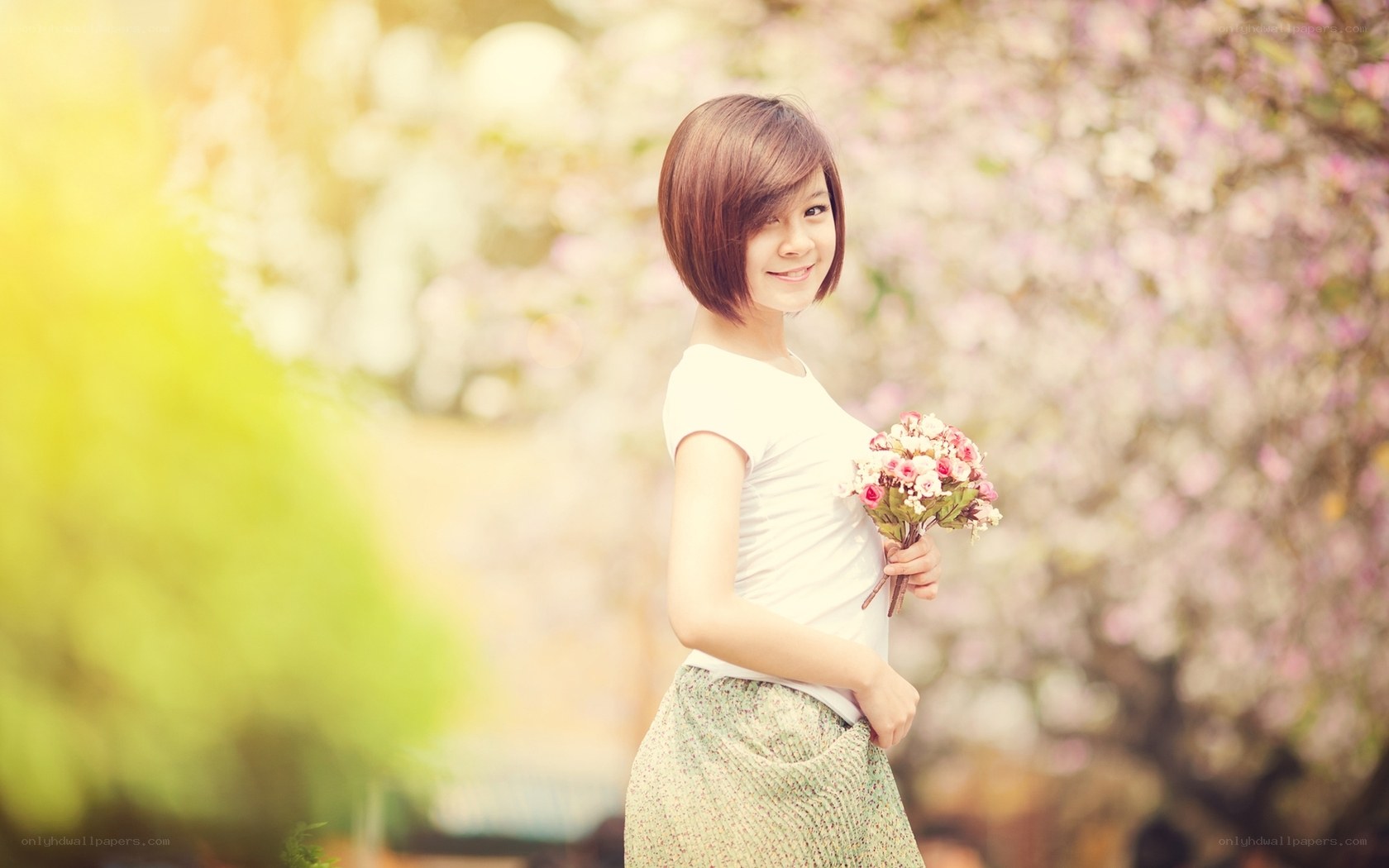 woman holding flowers in garden