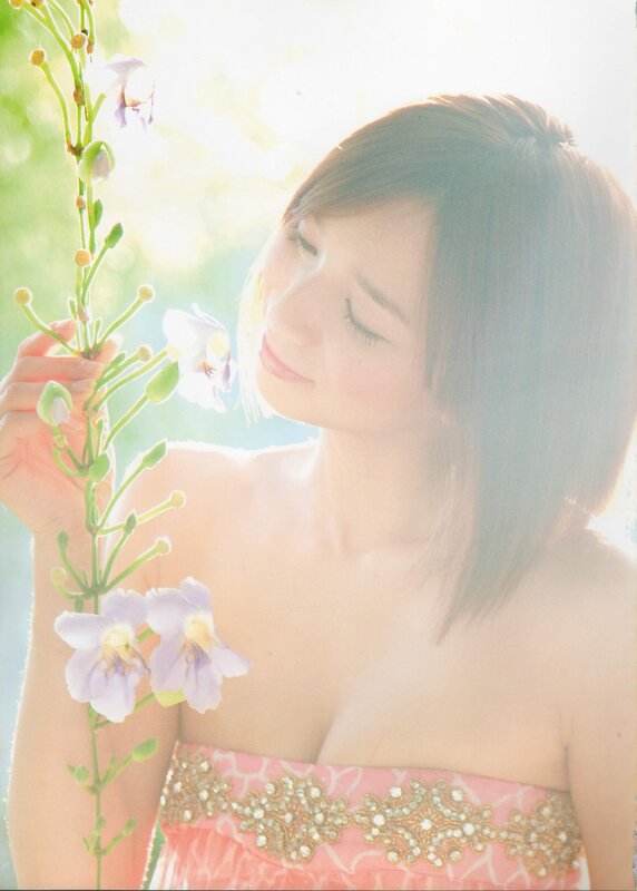 woman holding flowers in sunlight
