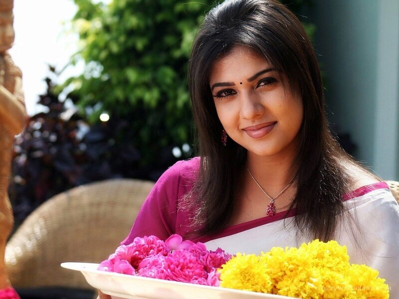 woman holding flowers in tray