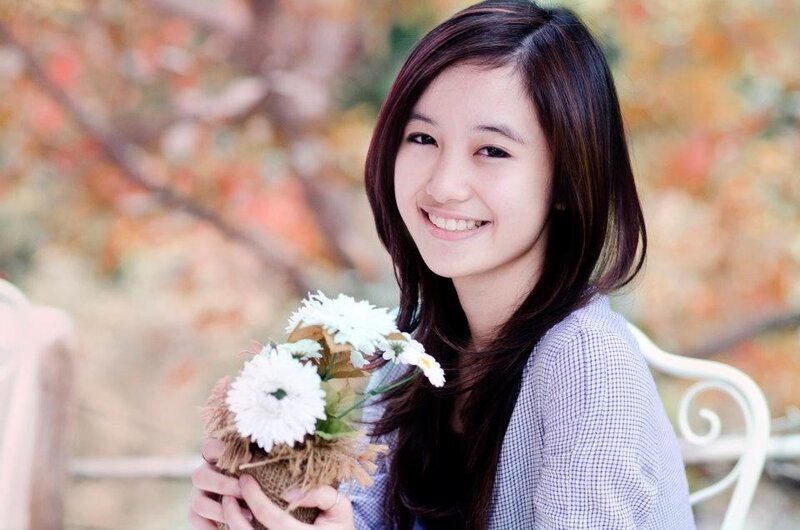 woman holding flowers outdoors