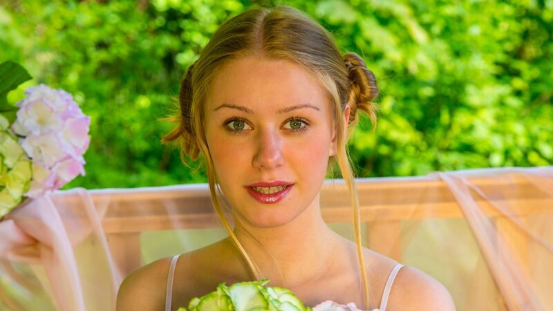 woman holding flowers outdoors