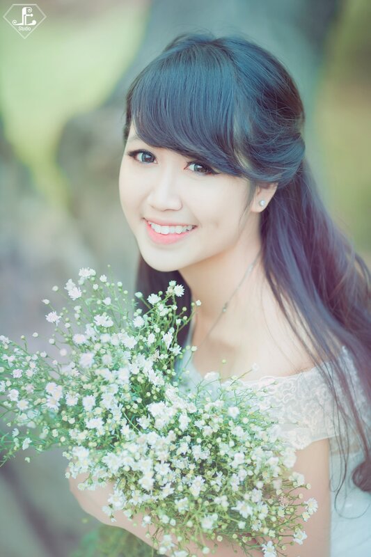 woman holding flowers outdoors