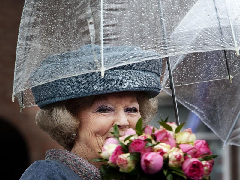 Woman Holding Flowers — Pink, Rainy