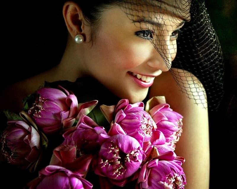 Woman Holding Flowers — Purple