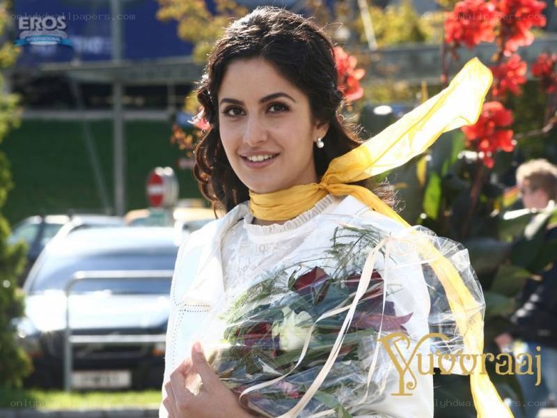 woman holding flowers smiling