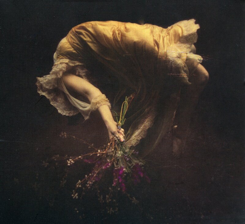 woman holding flowers underwater