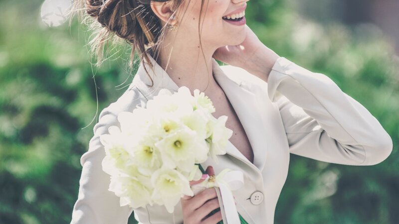 Woman Holding Flowers — White, Joyful