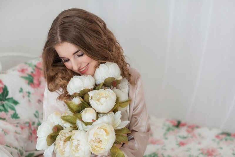 Woman Holding Flowers — White, Serene, Photograph, Bed