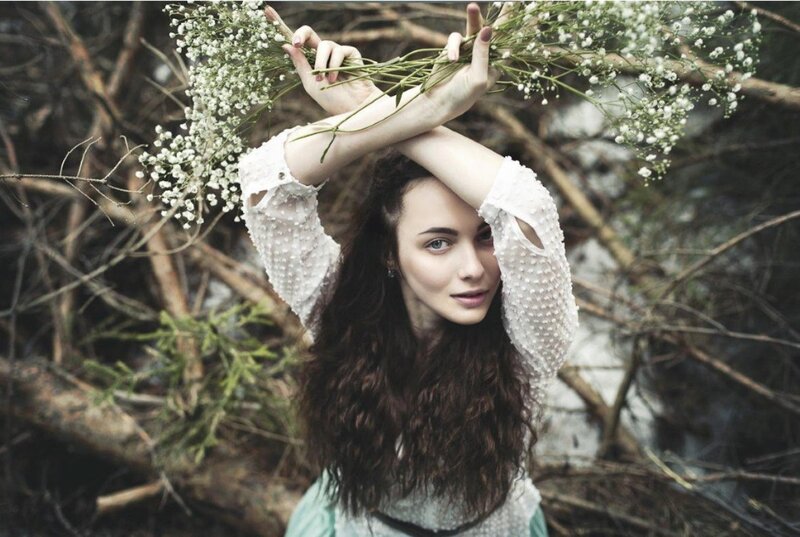 Woman Holding Flowers — White, Serene, Photograph, Branches