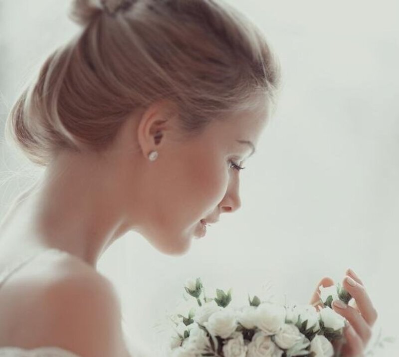 Woman Holding Flowers — White, Serene, Photograph, Earring