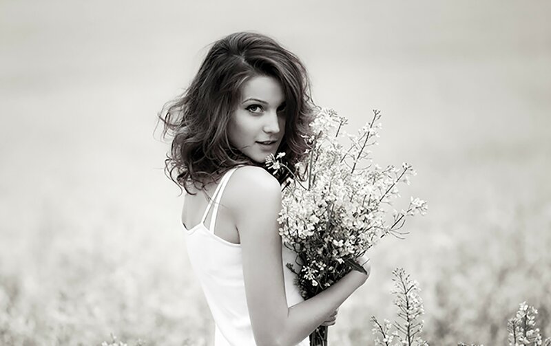 Woman Holding Flowers — White, Serene, Photograph, Field