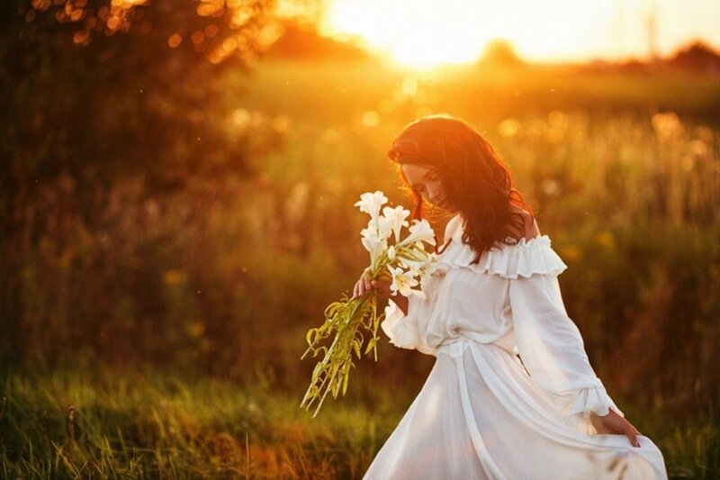 Woman Holding Flowers — White, Serene, Sunset, Photograph, Field