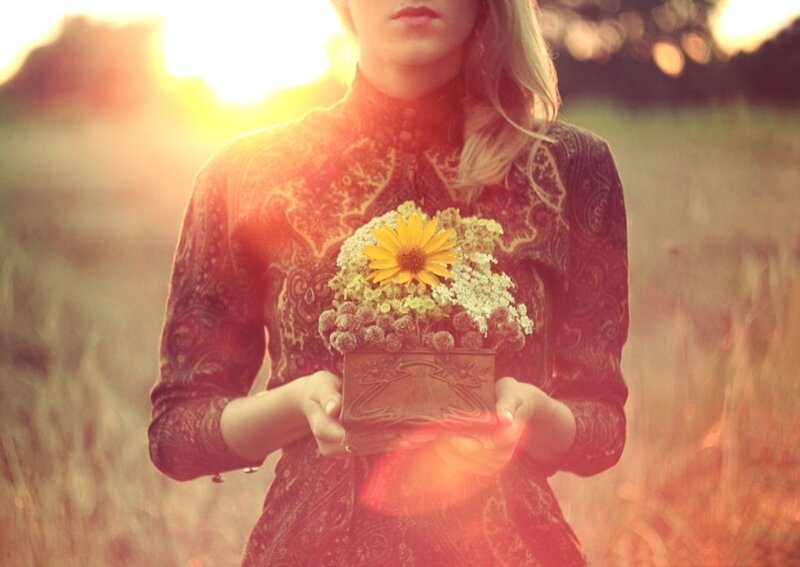 Woman Holding Flowers — Yellow, Serene, Sunset, Photograph