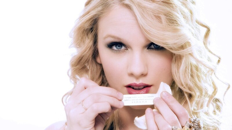 woman holding fortune cookie