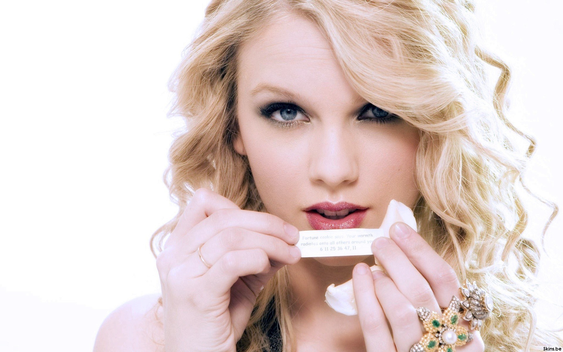 woman holding fortune cookie