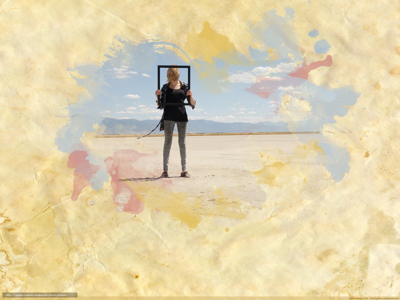 woman holding frame in desert