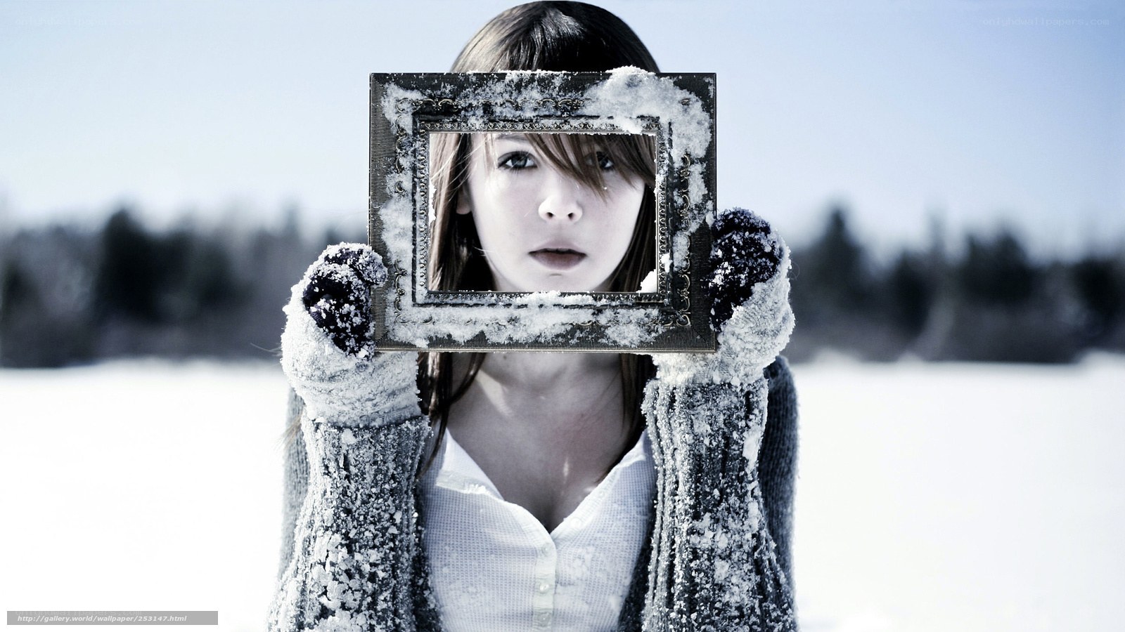 woman holding frame in snow