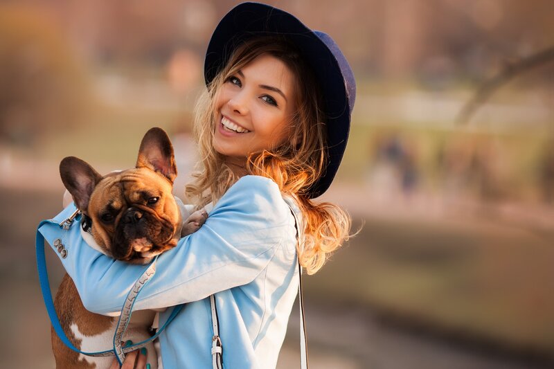 Woman Holding French Bulldog — Blue