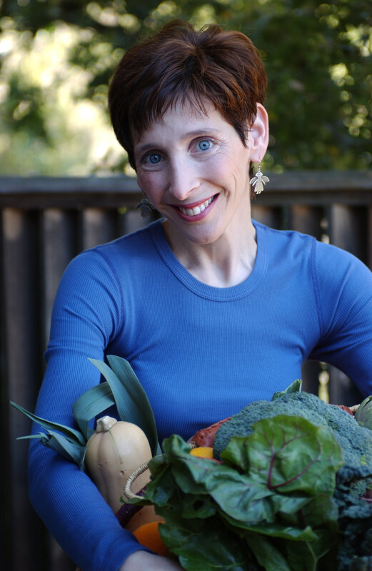 woman holding fresh vegetables