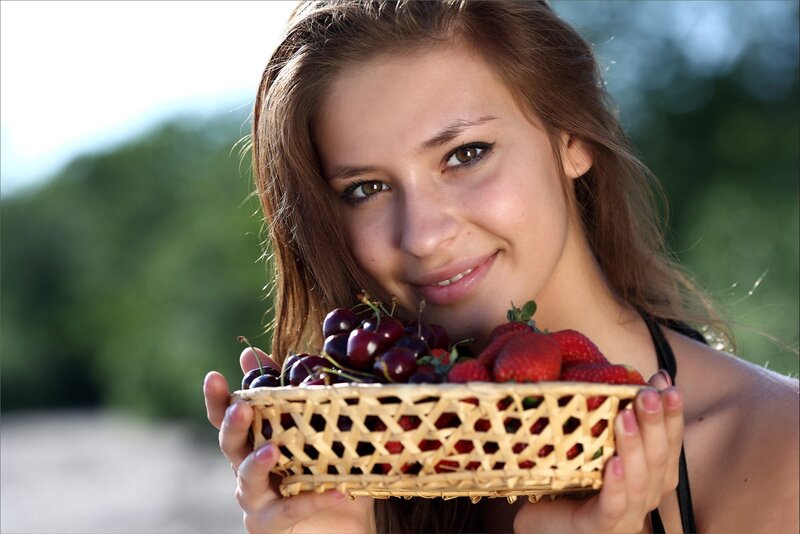 Woman Holding Fruit Basket — Brown