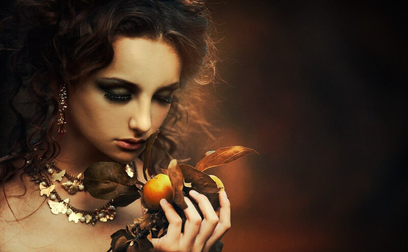 Woman Holding Fruit — Brown