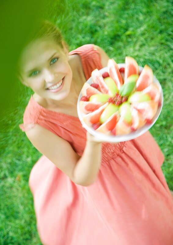 Woman holding fruit salad