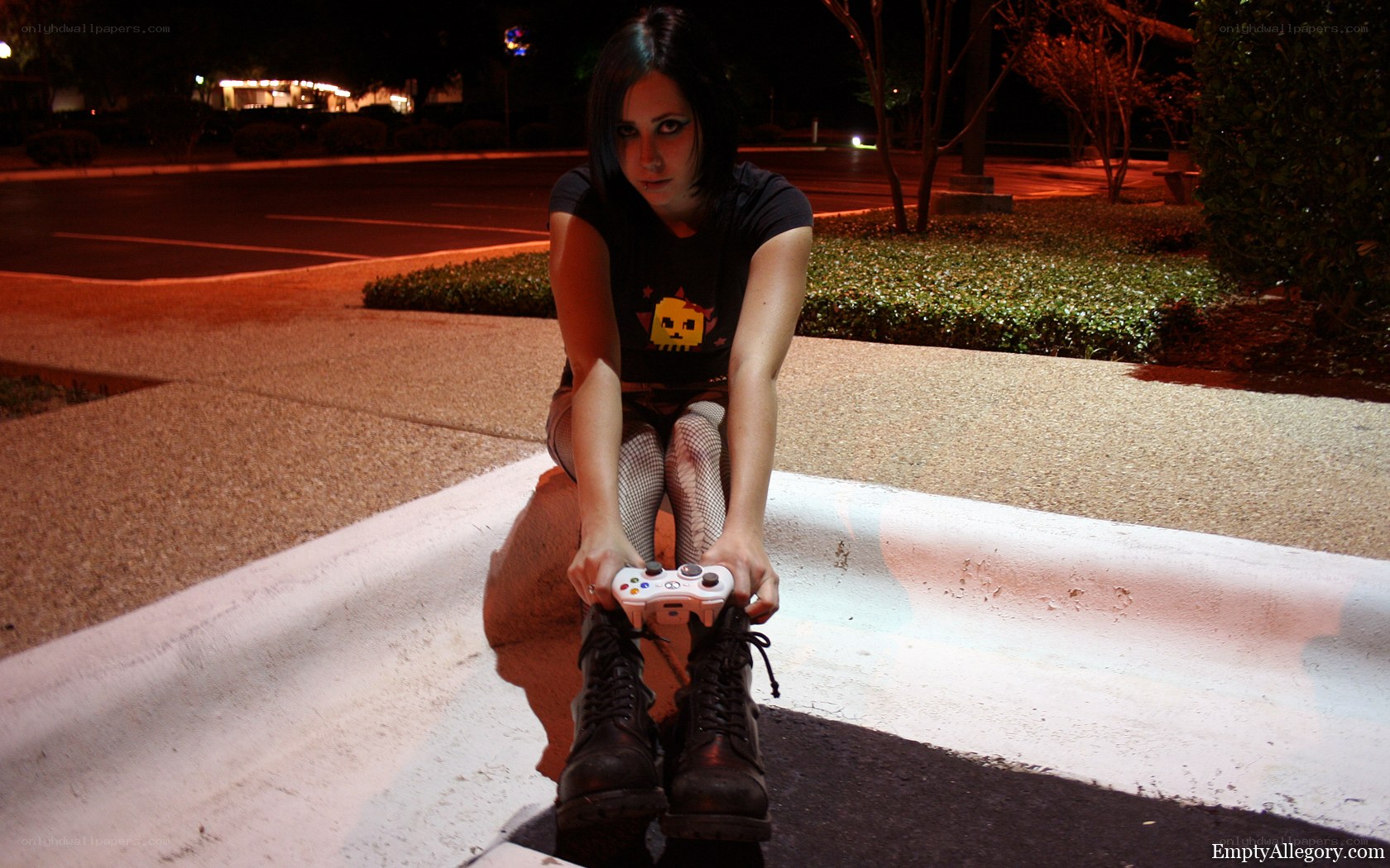woman holding game controller at night