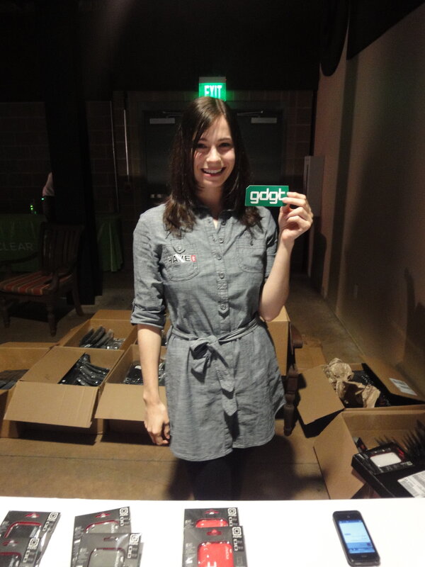 Woman holding gdgt card at event