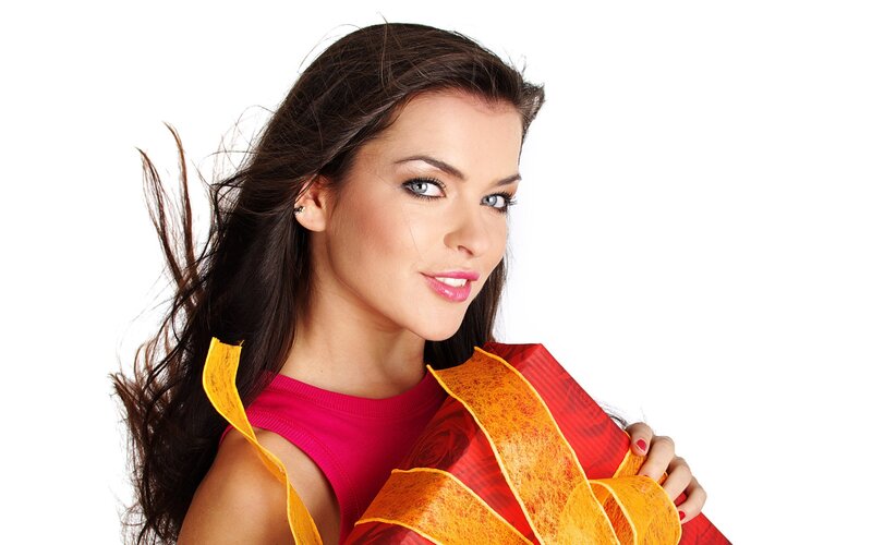 woman holding gift with ribbon